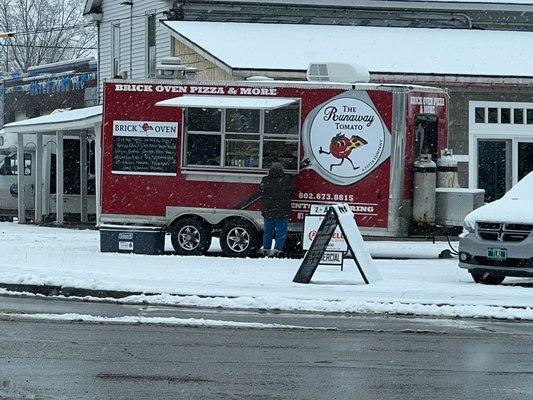 Hard to miss when he's there.  It's a busy corner by Cumberland Farms.