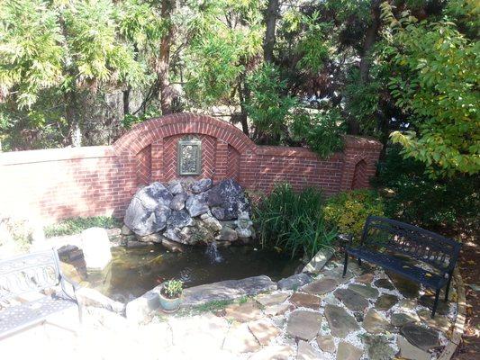 Relax by our backyard koi pond after a healing session.