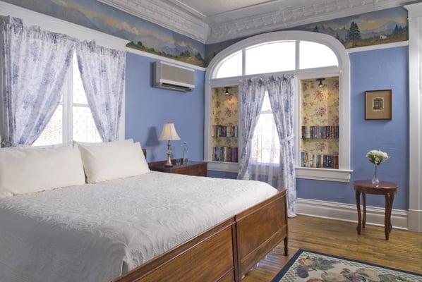 Cristy Room on main floor has king bed plus extra twin bed, full private bath, wall mural from 1930's.