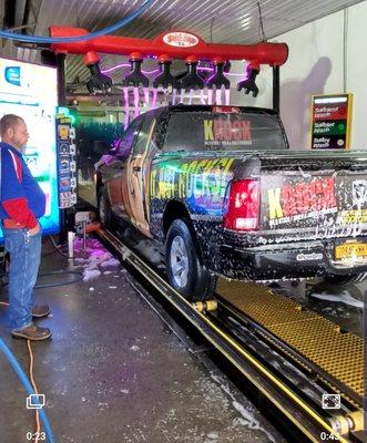 Top notch car washing equipment and our sign welcoming all of our customers.