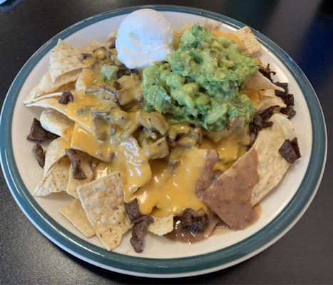 Absolutely the best nachos I have ever had.  The guacamole is perfect.  Better than mine.  The beans are so rich and creamy.