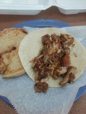 Pupusa and carnitas taco