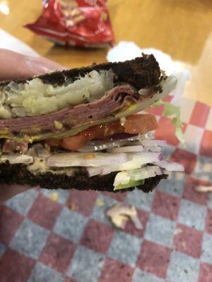 Sauerkraut, roast beef, lettuce, tomato, onion, green bell pepper, mustard and thousand island dressing.