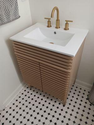 Bathroom vanity, sink and fixure installation.