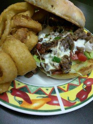 Asada torta and your choice of onion rings or fries