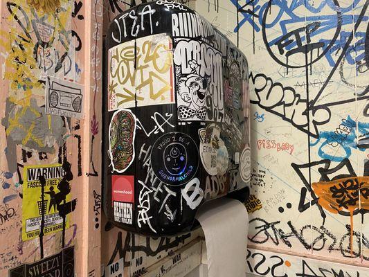 I love the graphitti in the bathroom, and this sticker (in the center) is awesome!