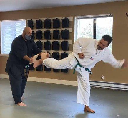 Breaking a board with a back kick for my Green/White Belt