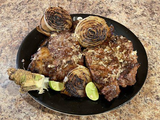 USDA prime ribeye steak, cut in half and charcoal grilled.  Topped with mixed freshly grated horseradish/EVOO/salt/key lime juice.