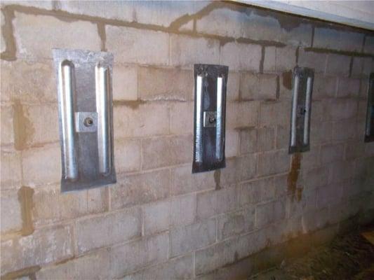 Placed along the horizontal crack, this row of Geo-Lock anchors has stabilized the bowing foundation wall of this Kalamazoo, MI home.