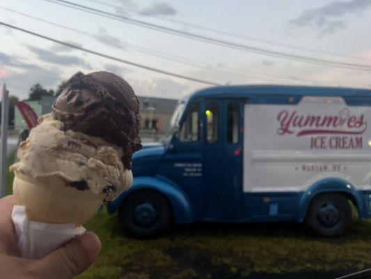 Small ice cream scoop of dark chocolate raspberry & peanut butter with chocolate chunks