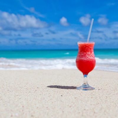 A Glass Of Rum Punch On The Sand On A Beach