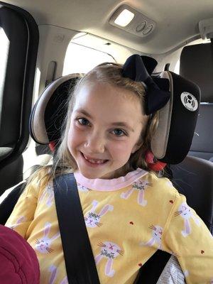 In the car in parking lot after treatment . She looks like a vibrant and healthy 7 year old again!