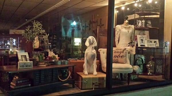 A evening view of the front windows at   The  Country Duck.