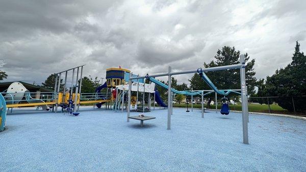 General kids play area and zip line with disability accessibility