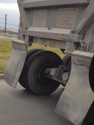 Rocks pouring out of truck.