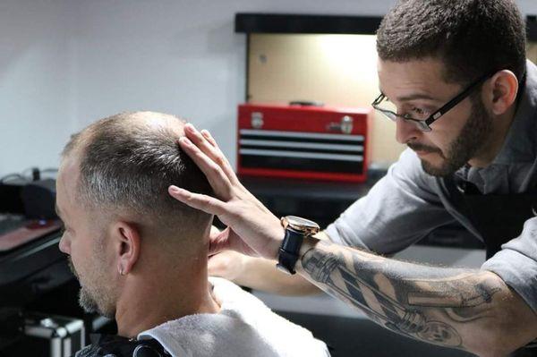 Lou putting the finishing touches using the straight razor.