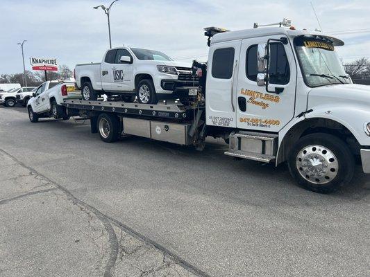 Towing 2 USIC Trucks at the same time using a flatbed tow truck