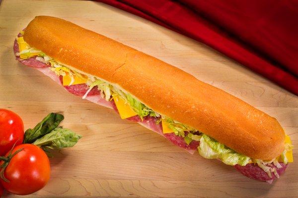 Sofia's Favorite Gondola Sub layered with sliced ham, salami, American cheese, & lettuce