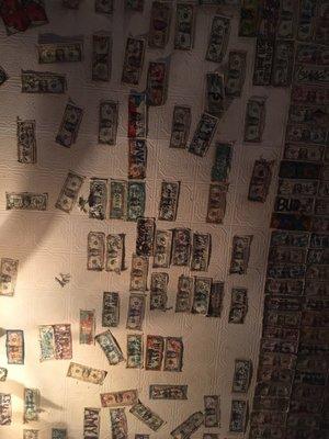 $1 bills stapled all over the ceiling.