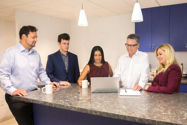 Chris Laug, Marty Bessolo, Elena Fontillas. Larry Haworth and Sasha Baluka meeting in the firm's Sherman Oaks HQ.