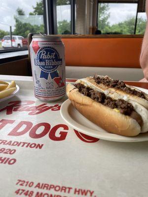 Chili dogs, fries and a beer.