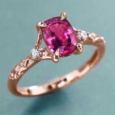 Beautiful color: an amazing pink tourmaline  gemstone set in rose gold with sparkly diamonds.