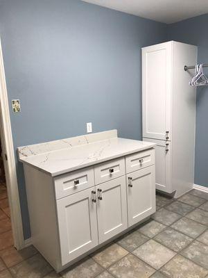 White shaker cabinets with quartz countertops