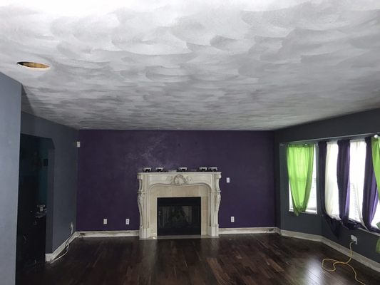 Resurface job on a living room-New sand finish plaster ceiling over existing ceiling.