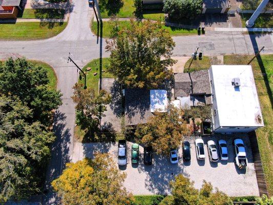 Showing the whole building off of 12th street, with the gravel parking lot.