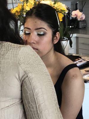 Quinceañera picture makeup being done by Kali