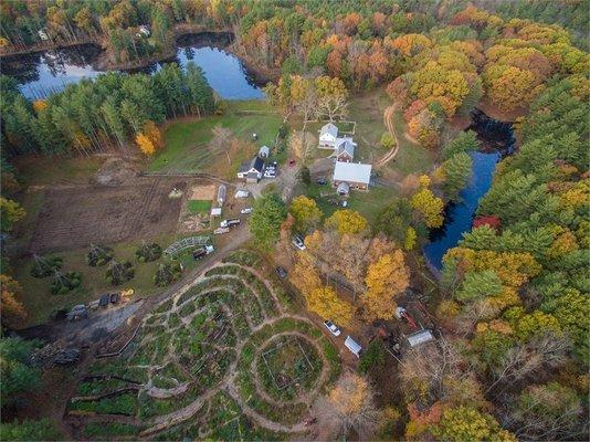 Aerial view of the farm buildings and fragrant herb gardens.