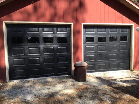 Black Raised Panel Garage Doors w/ Clear Glass in 3rd Panel