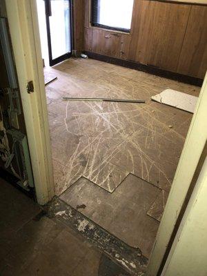 The layers of tile covering the Asbestos Containing Materials.