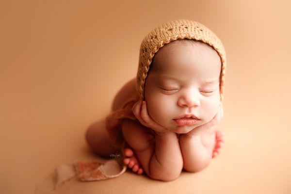 posed newborn session in the studio, froggy pose. babies typically within the first 1-3 weeks after birth