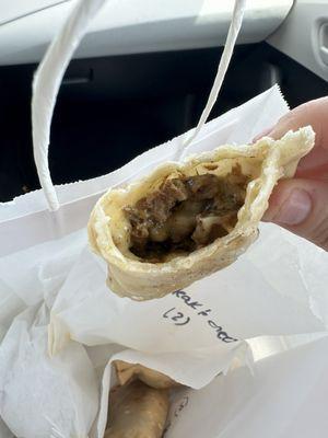 Steak and cheese empanada