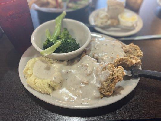 Chicken fried steak, mashed potatoes, and steamed broccoli