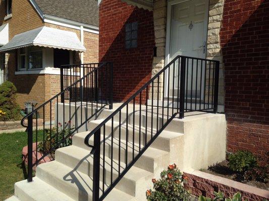 Concrete steps and metal guardrails give a nice contrast with the red masonry facade!!!