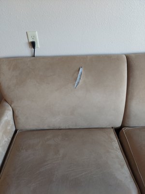 Torn couch in our room also had stains on it.