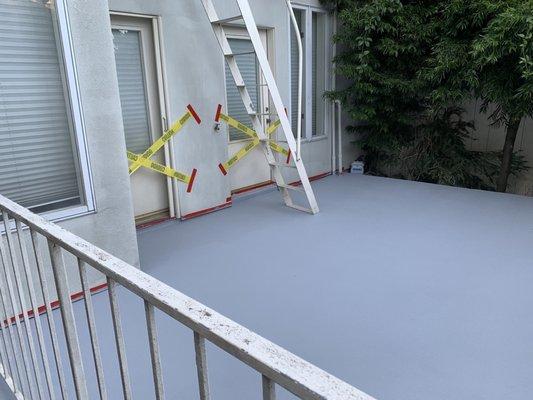 Finished Patio.   Yellow tapes are just temporary barriers to prevent foot traffic while drying.