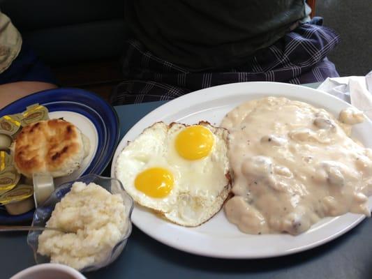 Country fried steak with grits and biscuit