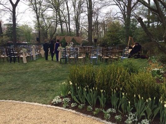 The ceremony site. Beautiful baby's breath, lace, burlap mix with wooden chairs and benches. Thank you Ellen for your genius!