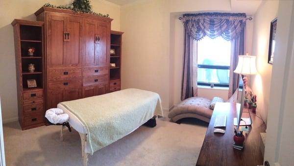 Comfortable, cozy, and spacious massage room--complete with soothing music and lighting options.