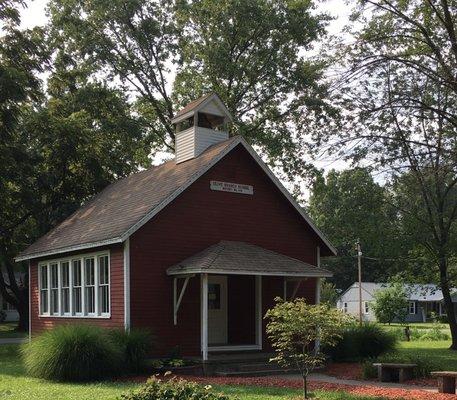 An original red schoolhouse on the park grounds.