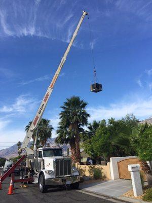 New ac unit being installed via crane