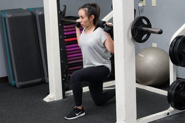 The Smith machine lunge is a variation of the lunge and an excellent exercise choice for isolating muscles of the leg.