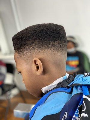 Flat top with a skin fade, done by "ChamirCraft"