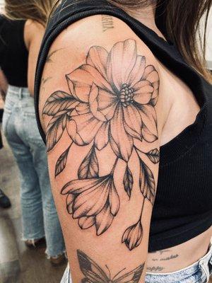 Freehand blackwork Magnolias done by Courtney!