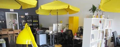 Inside the office of Skuba Design Studio where we create web design and graphic design projects under our yellow umbrellas.