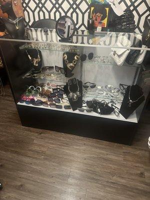 Display case with earrings and purses