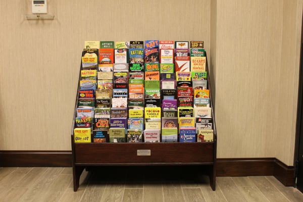 A standard, wooden floor model brochure stand.